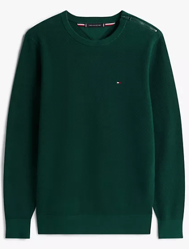 Tommy Hilfiger classic crewneck sweater in a clean, minimalist setting, showcasing an affordable and stylish winter option for men.
